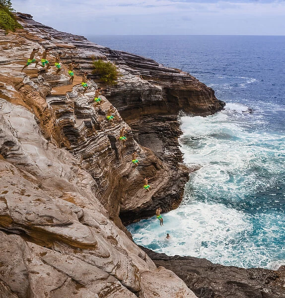 USA, Hawaii, Oahu, Honolulu. Multiple exposure stop action photo of jump off cliff