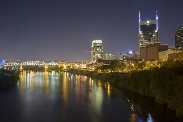 USA, Tennessee, Nashville. City lights reflected in Cumberland River