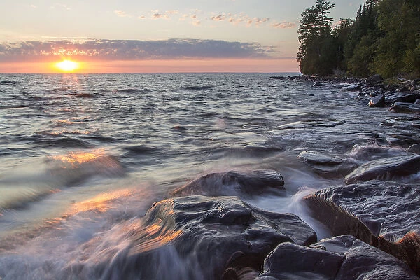 Waves crash at sunset on Devils Island in the Apostle Islands National Lakeshore