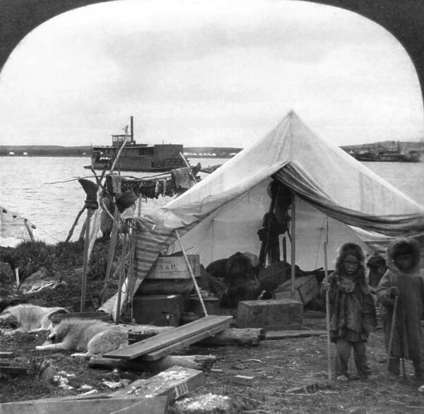 ALASKA: ESKIMO CAMP, c1905. A Malamut Indian camp on the Yukon in Alaska, with