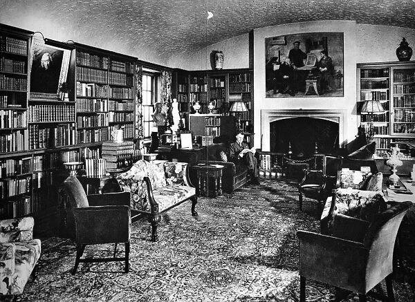 ALFRED EDWARD NEWTON (1864-1940). American bibliophile. Photographed in the library of his home