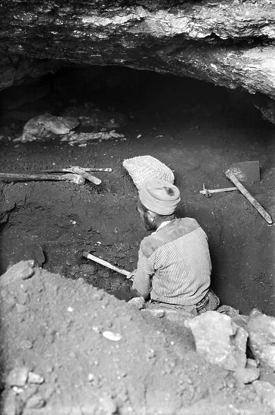 ARCHAEOLOGY: GEZER, 1934. A worker on an archaeology site at Gezer, Palestine