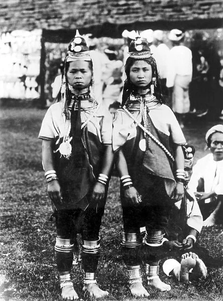 BURMA: PADAUNG GIRLS. Two standing Padaung girls from the South Shan States dressed