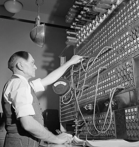 CHICAGO: TELEGRAPH BOARD. An operator at the switch board in the Pennsylvania Railroad