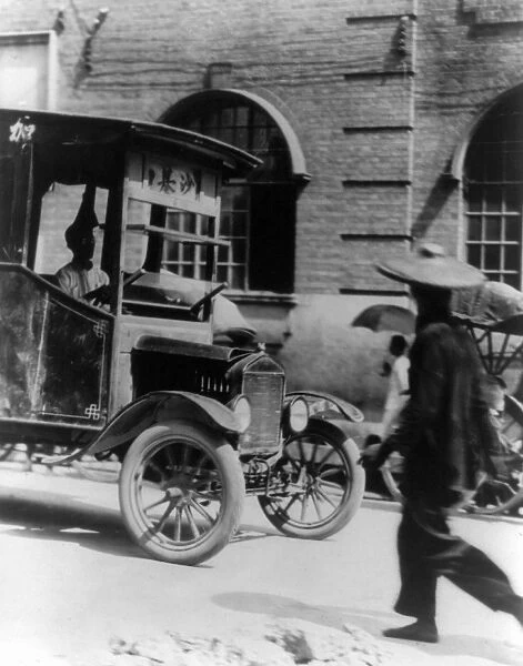 CHINA: CANTON, 1924. A motor bus on the streets of Canton. Photograph, 1924