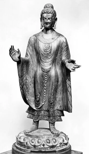 Chinese Northern Wei (386-557 A. D. ) gilt bronze standing figure of Buddha standing with outstretched arms on a lotus pedestal. Height: 55. 25 inches; width: 19. 5 inches
