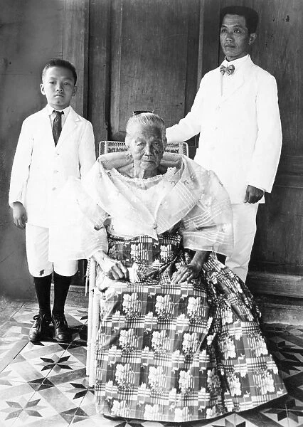 EMILIO AGUINALDO (1869-1964). Filipino leader. With his mother and son at his home at Cavite