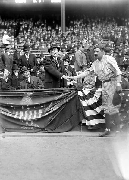 GEORGE H. RUTH (1895-1948). Known as Babe Ruth. American professional baseball player. Ruth shaking hands with President Warren G. Harding at Yankee Stadium, New York City, 24 April 1923. Also in the box are Doctor Charles Sawyer and Albert Lasker