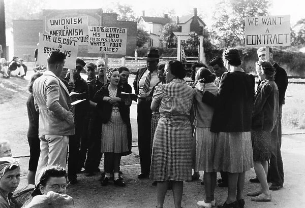 GEORGIA: PICKETERS, 1941. Striking garment workers in a picket line outside a textile