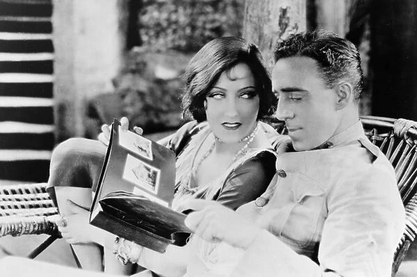 GLORIA SWANSON (1897-1983). American film actress. With director Raoul Walsh on the set of the silent film Sadie Thompson, 1928, after Somerset Maughams play Rain
