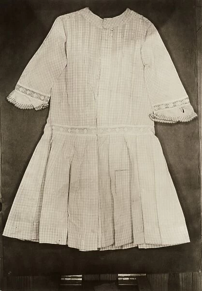HINE: GARMENT, c1912. A finished dress from a factory in America. Photograph by Lewis Hine