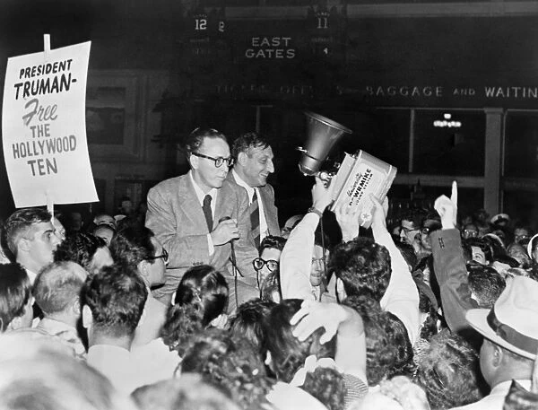 HOLLYWOOD TEN, 1950. Dalton Trumbo and John Howard Lawson, surrounded by supporters