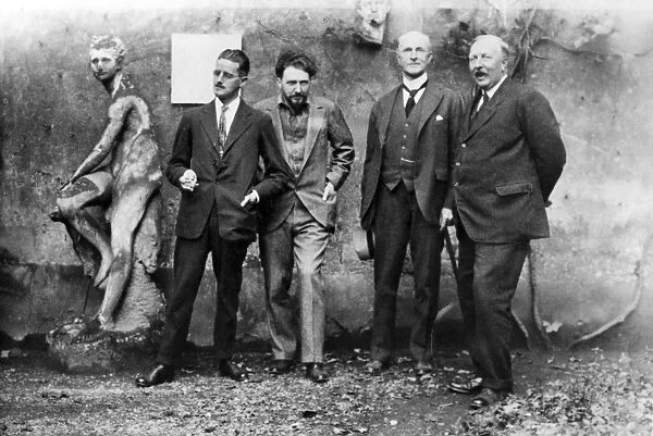 JOYCE, POUND, QUINN & FORD. From left to right: Writers James Joyce and Ezra Pound;lawyer and patron of the arts, John Quinn;and writer Ford Madox Ford. Photographed at Pounds home in Paris, 1923