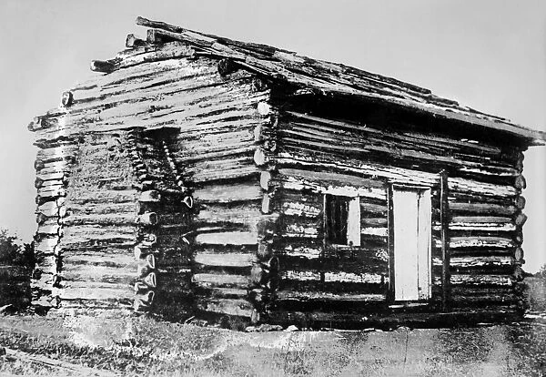LOG CABIN. An old log cabin in rural America. Photograph, c1865