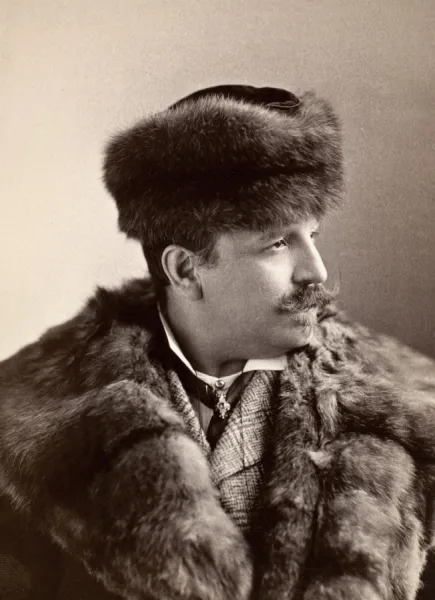 MENs FASHION, 1890s. Unidentified man sporting a fur coat and fur hat, 1890s