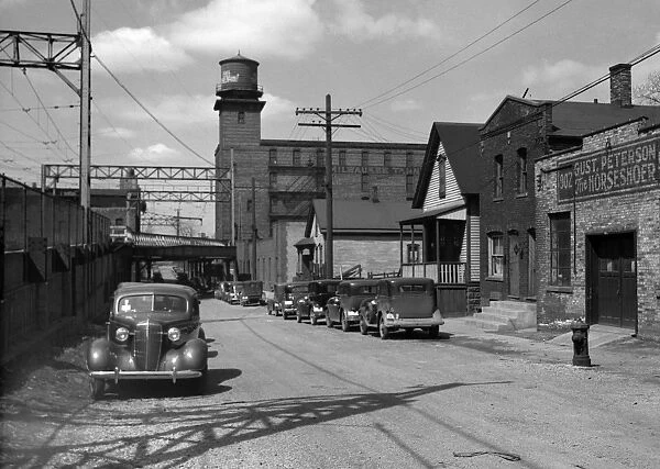 MILWAUKEE: STREET, 1936. Working class houses on Detroit and Van Buren Streets