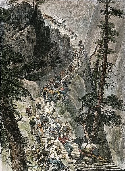MINERS ON CORDUROY ROAD. Prospectors traveling on their way to a new strike over a corduroy road through a Colorado mountain pass. American engraving, 1879