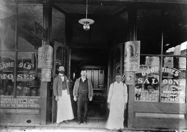 Moses Weinberger (center) with bartenders Mack O Brien (left) and Ike Reed at the entrance to the Same Old Moses Saloon at 211 West Harrison Avenue in Guthrie, Oklahoma, operated by Weinberger since 1890 as the first legal saloon in the Oklahoma Territory. Photographed c1900