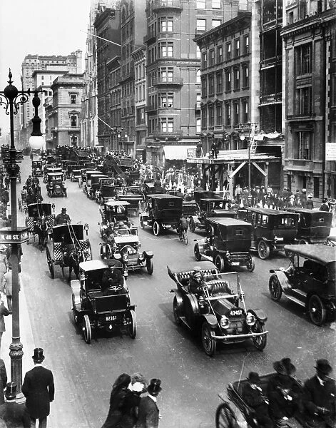 NEW YORK CITY: TRAFFIC, c1910. Carriage and automobile traffic along 5th Avenue