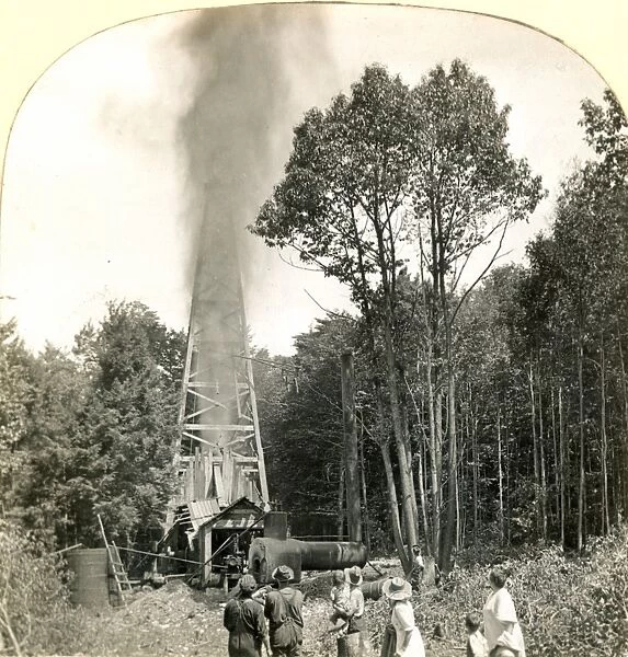 OIL WELL, c1920. Shooting a new oil well with nitroglycerin in Pennsylvania, c1920
