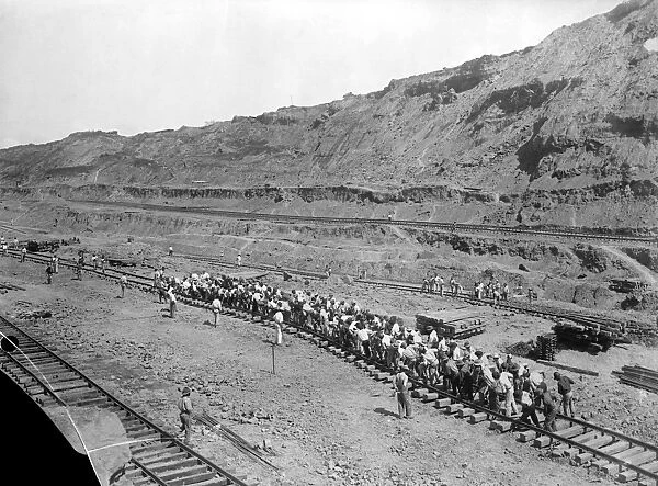 PANAMA: RAILWAY, c1912. A gang of approximately 150 men shifting track by hand