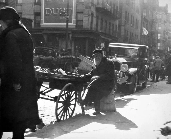 PEDDLER, c1915. A pushcart peddler, c1915, in an unidentified American city