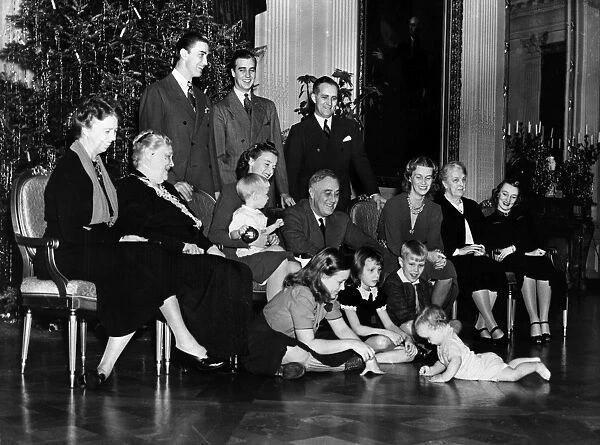 President Franklin Delano Roosevelt and his extended family posing for a Christmas photograph in the East Room of the White House, 24 December 1939