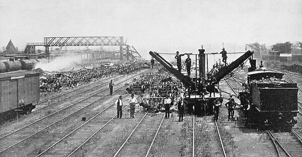 PULLMAN STRIKE, 1894. A wrecking-crew clearing a Chicago railway yard of burned freight cars