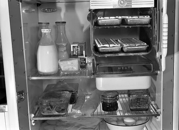 REFRIGERATOR, 1942. Demonstrating the proper way to arrange food in a refrigerator