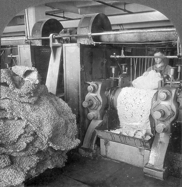 RUBBER FACTORY, 1920s. Corrugating and washing the rubber received from a plantation