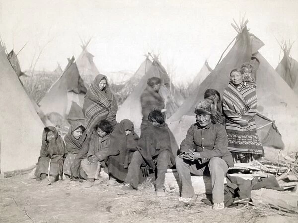 SIOUX ENCAMPMENT, 1891. Group of Minionjou Sioux Native Americans in a tipi camp, probably on or near the Pine Ridge Reservation in South Dakota. Photographed in 1891 by John C. H. Grabill