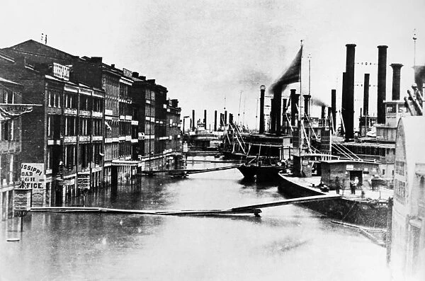 ST. LOUIS: FLOOD, 1858. A view of the Mississipi River waterfront in St. Louis