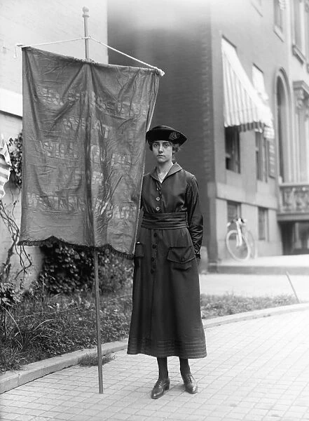 SUFFRAGETTE WITH BANNER. Suffragette in Washington, D. C. with a banner reading Mr