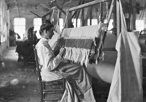 TEXTILE WORKER, c1910. A New England textile worker. Photographed c1910 by Lewis Hine