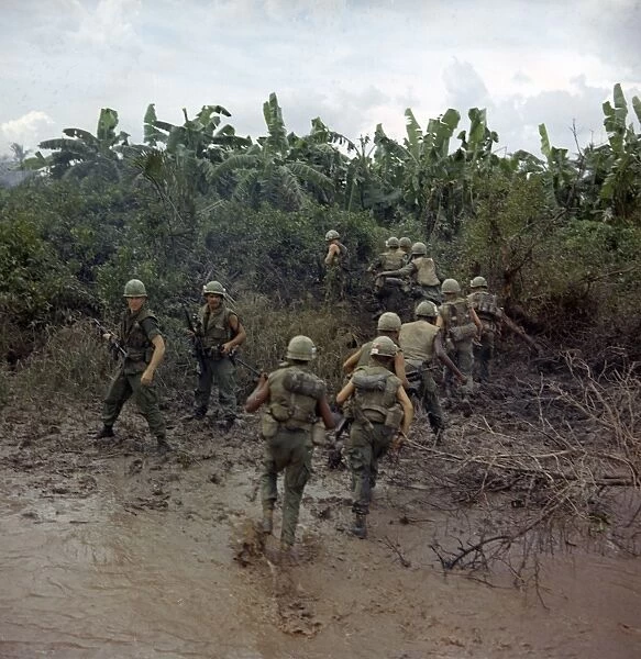 VIETNAM WAR, 1967. Troops of the Mobile Riverine Force arriving on land for an assault mission