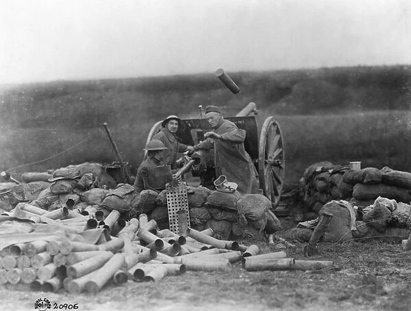 WORLD WAR I: ARTILLERY, c1917. Artillery shell being discharged from a heavy gun