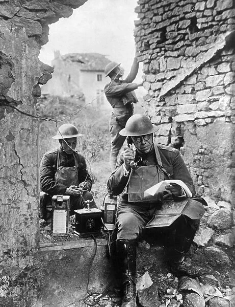 WWI: TELEPHONE, c1917. Communications officers operate a field telephone. Photograph