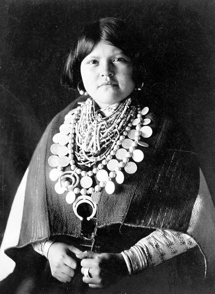 ZUNI WOMAN, c1903. A Zuni woman wearing lots of jewelry. Photograph by Edward Curtis