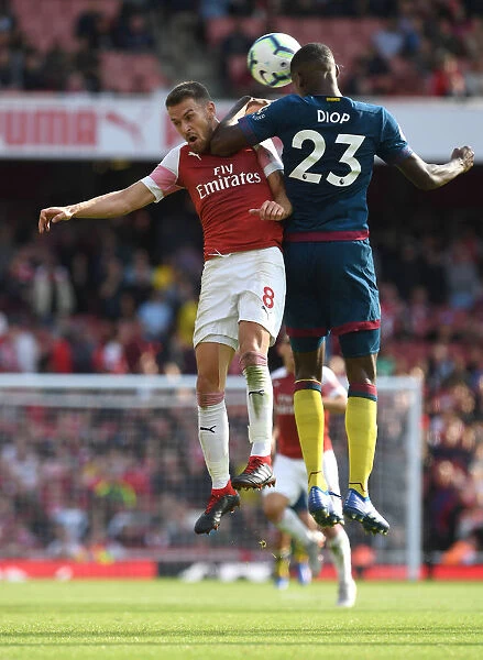 Arsenal's Aaron Ramsey Clashes with West Ham's Issa Diop in Premier League Showdown