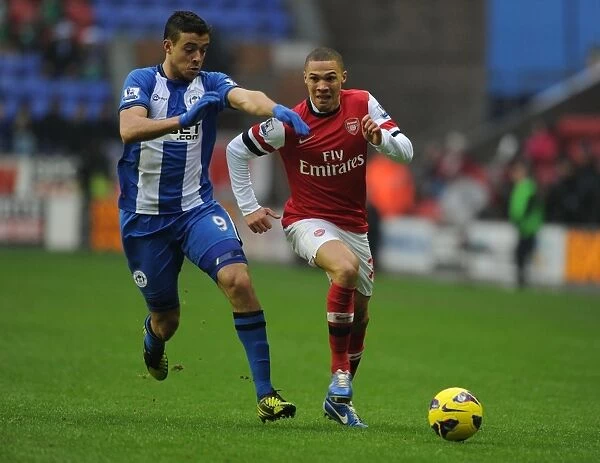 Arsenal's Kieran Gibbs Outruns Wigan's Franco Di Santo during the 2012-13 Premier League Clash