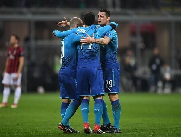 Arsenal's Mkhitaryan, Wilshere, and Xhaka Celebrate Goal Against AC Milan in Europa League