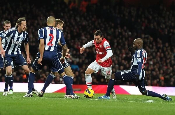 Arsenal's Santi Cazorla Fights Past West Brom Defenders