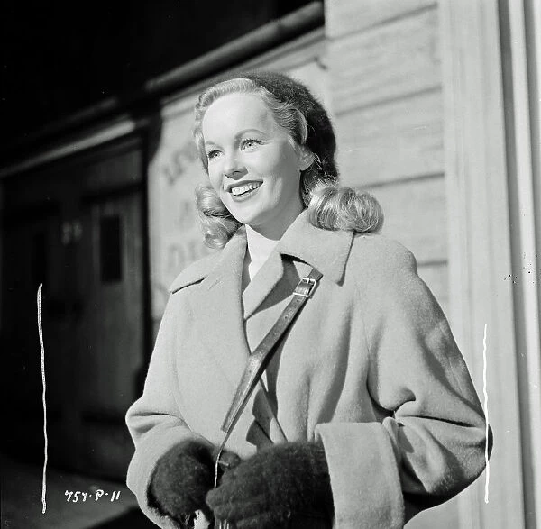 A smiling Peggy Cummins as Kitty in Meet Mr. Lucifer