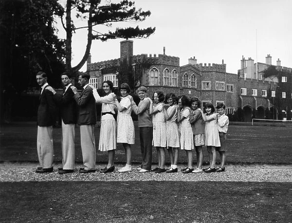 Twelve young people standing in a line