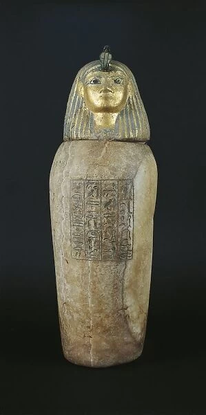 Alabaster and gold leaf canopic jar with human head, symbol of genius Imset, protector of liver, son of Horus from Tanis, tomb of Psusennes I, crypt