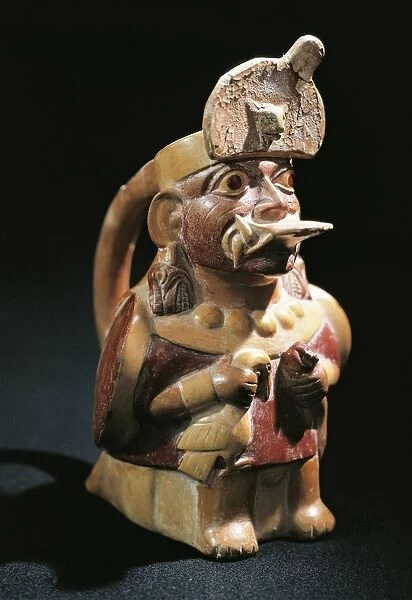 Anthropomorphic polychrome terracotta vessel in shape of priest holding sacrificial animals, Pre-Inca civilization, Peru, Moche culture