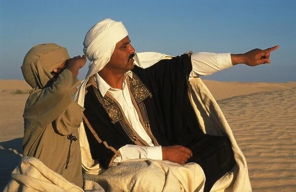 Bedouin father and son in the Sahara