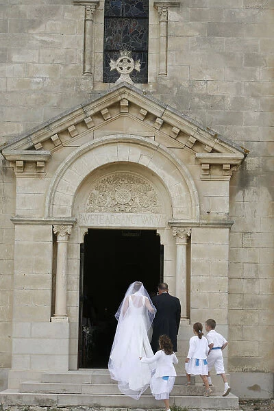 Bride walking into church