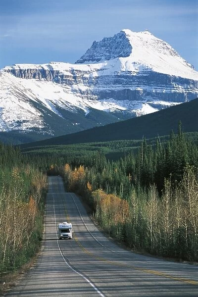 Canada, Alberta, Banff National Park (UNESCO World Heritage List, 1984, 1990). Tarmac road at foot of Rocky Mountains