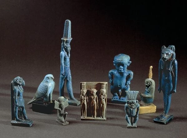 Ceramic amulets depicting deities Taweret, Horus, Thoth, Maat, Sekhmet, Bes. Late Period